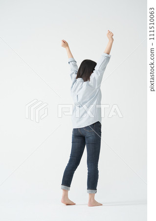 The young woman is stretching. 111510063