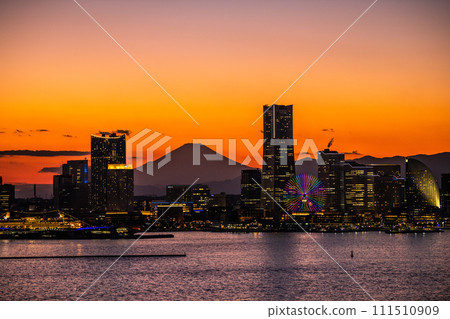 Japan's Yokohama cityscape Minato Mirai and Mt. Fuji reflected in the sunset. The left side of the front is towards Sakuragicho Station. 111510909