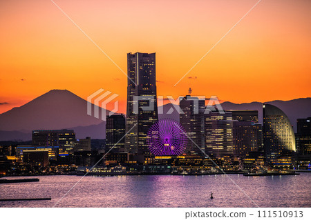 Japan's Yokohama cityscape Minato Mirai and Mt. Fuji reflected in the sunset. Back left is towards Sakuragicho Station 111510913