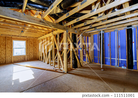 Unfinished house construction with wooden framing beams work in progress view 111511001