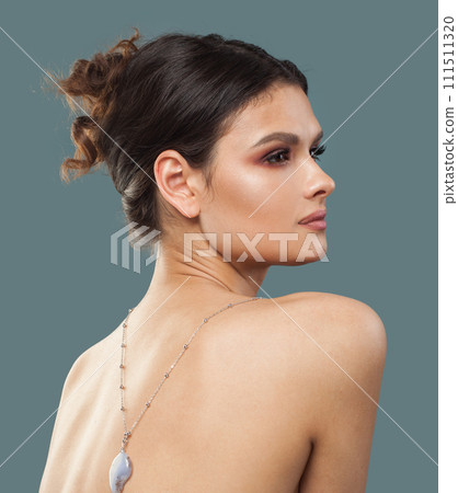 Cute stylish brunette fashion model with makeup, wavy hairstyle and healthy clean skin posing  111511320