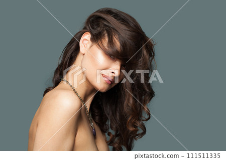 Lovely stylish brunette fashion model with makeup, wavy hairstyle and healthy clean skin posing Lovely stylish brunette fashion model with makeup, wavy hairstyle and healthy clean skin posing 111511335
