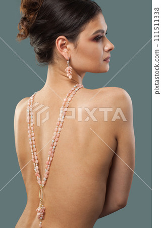 Nice stylish brunette fashion model with makeup, wavy hairstyle and healthy clean skin posing Nice stylish brunette fashion model with makeup, wavy hairstyle and healthy clean skin posing 111511338