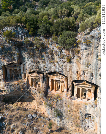 Dalyan, Mugla. Turkey Kings tombs in the cliff face Kaunos Dalyan, Turkey. Aerial view . High quality photo 111511925