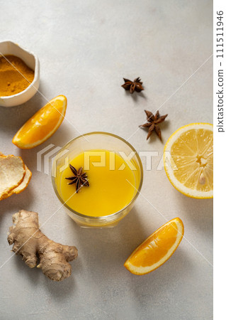 Immune boosting drink. Ginger, orange fruit and turmeric shot drink, healthy beverage. Immune boosting drink. Ginger, orange fruit and turmeric shot drink, healthy beverage. 111511946