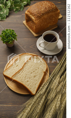 Bread, coffee, and ears of wheat 111512162