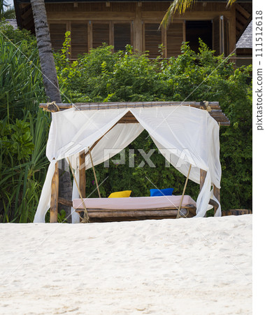 Wonderful luxury beach canopy at luxurious beach resort at sunset Wonderful luxury beach canopy at luxurious beach resort at sunset 111512618