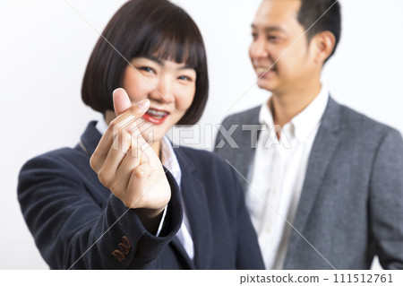 Asians executive businessman and businesswoman smile and standing on white background. Asians executive businessman and businesswoman smile and standing on white background. 111512761