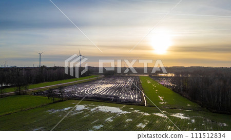 Aerial View of Sunset Over Agricultural Plastic Coverings Aerial View of Sunset Over Agricultural Plastic Coverings 111512834