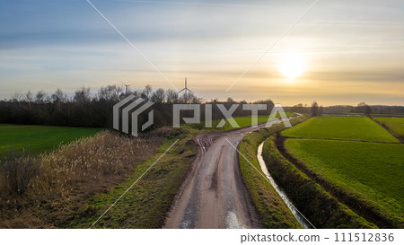 Sunset Horizon Over Winding Country Road Sunset Horizon Over Winding Country Road 111512836