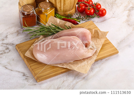 Raw chicken breast served rosemary Raw chicken breast served rosemary 111513630