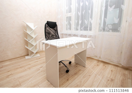 Desk and chair in bright room closeup Desk and chair in bright room closeup 111513846