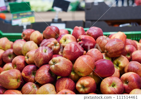 Red and yellow apples in the boxes in big grocery store. ripe apples 111514461