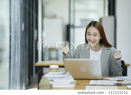 Successful Businesswoman Celebrating a Triumph at Work. Successful Businesswoman Celebrating a Triumph at Work. 111515212