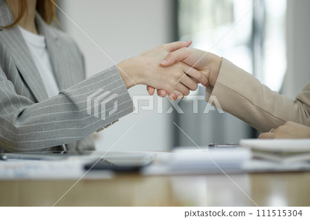 Close-up of Professional Handshake in Business Meeting. 111515304