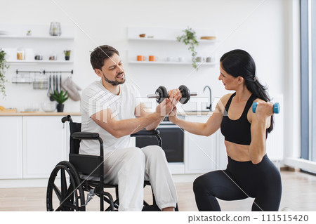 Male patient undergoing rehabilitation after illness in of apartment. 111515420