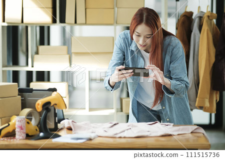 Online Business Owner Photographing Apparel for SaleOnline Business Owner Photographing Apparel for Sale. 111515736