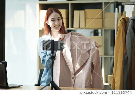 Entrepreneur Showcasing Clothes for Online Store Entrepreneur Showcasing Clothes for Online Store 111515744