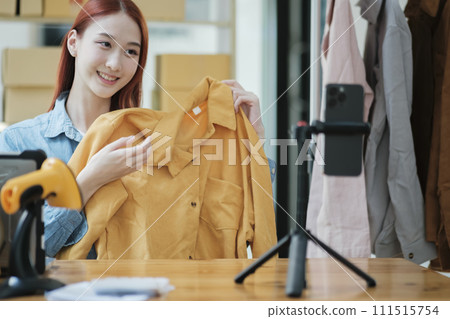 Entrepreneur Showcasing Clothes for Online Store Entrepreneur Showcasing Clothes for Online Store 111515754