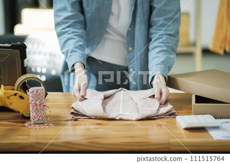 Small Business Owner Preparing Order for Shipment 111515764