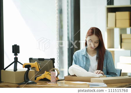 Small Business Owner Preparing Order for Shipment Small Business Owner Preparing Order for Shipment 111515768