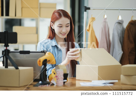 Small Business Owner Preparing Order for Shipment 111515772