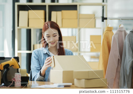 Small Business Owner Preparing Order for Shipment 111515776