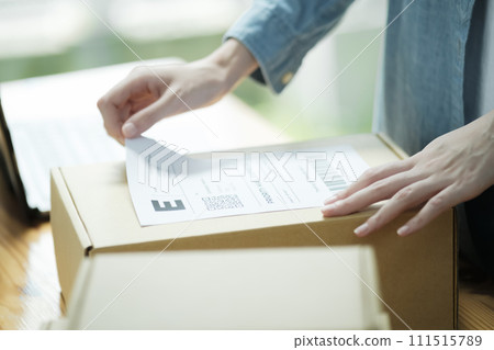 Attaching Shipping Label to a Parcel Attaching Shipping Label to a Parcel 111515789