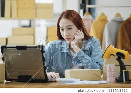 Woman seller SME retail owner feeling upset and disappointed about her recent sell record. 111515811