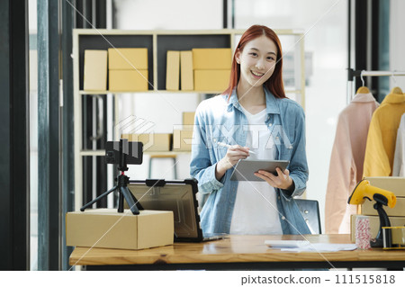 Confident woman portrait entrepreneur at ecommerce fashion or warehouse looking at camera. Confident woman portrait entrepreneur at ecommerce fashion or warehouse looking at camera. 111515818