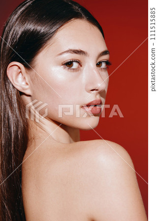 Radiant Beauty: A Young Woman's Glamorous Close-up Portrait with Natural Makeup and Luscious Lips on a Clean, Bright Background Radiant Beauty: A Young Woman's Glamorous Close-up Portrait with Natural Makeup and Luscious Lips on a Clean, Bright Background 111515885