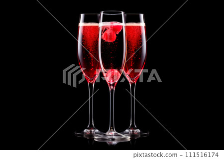 Set of pink crystal-clear flute glass of champagne isolated on black background Set of pink crystal-clear flute glass of champagne isolated on black background 111516174