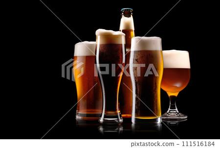 Set of Beer glasses and bottles on a black background. Mugs with drink like Ipa, Pale Ale, Pilsner, Porter or Stout Set of Beer glasses and bottles on a black background. Mugs with drink like Ipa, Pale Ale, Pilsner, Porter or Stout 111516184