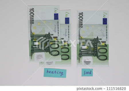 Banknotes with heating and food signs. The concept is to increase the cost of heating Banknotes with heating and food signs. The concept is to increase the cost of heating 111516820