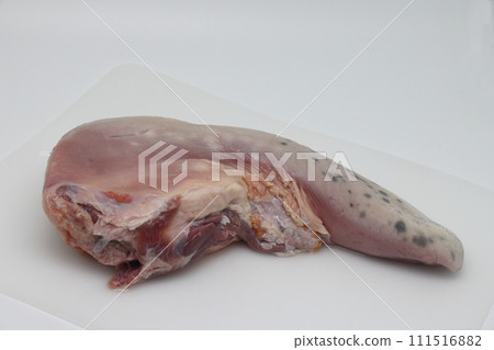 Raw beef tongue isolated on white background. Raw beef tongue isolated on white background. 111516882