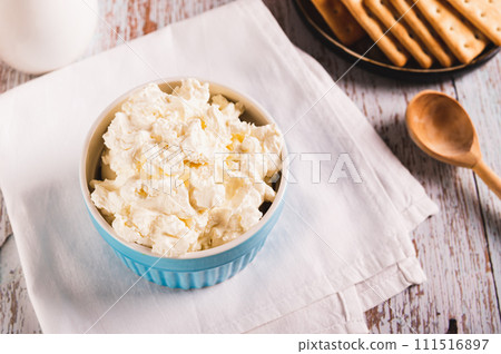 Fresh Italian mascarpone cheese in a bowl on the table Fresh Italian mascarpone cheese in a bowl on the table 111516897