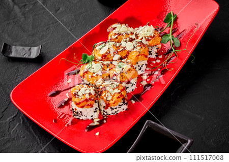 Sushi rolls with seared cheese and seafood caps sprinkled with parmesan Sushi rolls with seared cheese and seafood caps sprinkled with parmesan 111517008