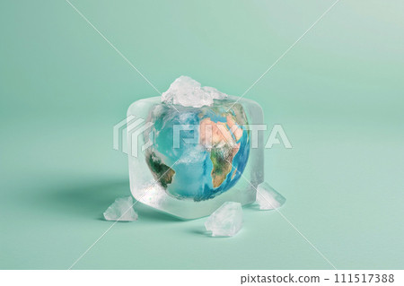 Frozen earth globe inside an ice cube on pastel background with copy space. Climate change and long winter concept, planet Earth is covered by ice and snow 111517388