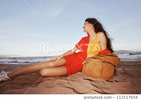 Travel Joy: Backpacking through Nature's Beaches - The Serene Sands of a Free-Spirited Tourist's Relaxing Adventure 111517658