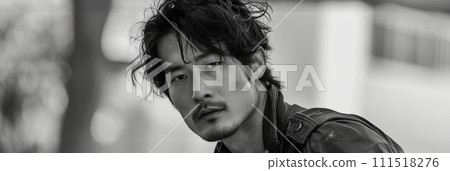 Black and white photo of a handsome Asian man, close-up portrait of a man ,banner 111518276