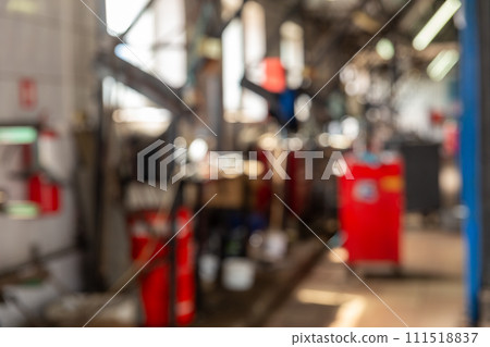 Blurred background image with cars in automobile repair service Blurred background image with cars in automobile repair service 111518837