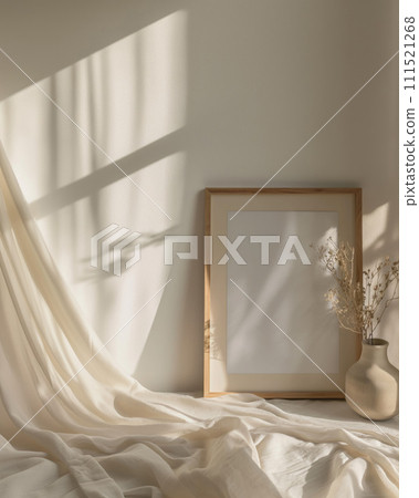 Blank wooden poster patterned frame mock up template on the nightstand next to the bed, room interior in fusion style with milk color cover, curtains. Play of light and shadow Blank wooden poster patterned frame mock up template on the nightstand next to the bed, room interior in fusion style with milk color cover, curtains. Play of light and shadow 111521268