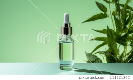 face serum dropper bottle on green background with nature plant decoration 111521863