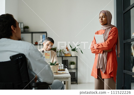 Manager making report to colleagues Manager making report to colleagues 111522226