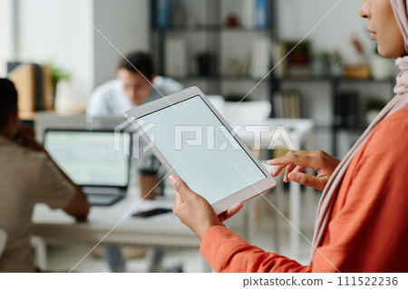 Tablet with blank screen held by manager Tablet with blank screen held by manager 111522236