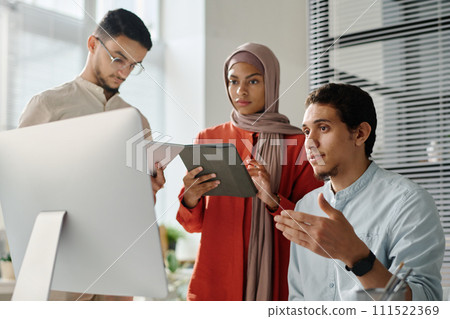 Teamwork of three young office managers Teamwork of three young office managers 111522369