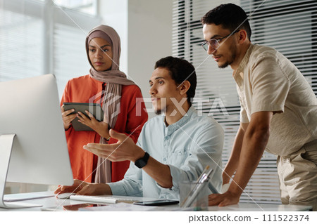 Meeting of three Muslim employees 111522374