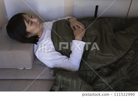 woman sleeping in a camper woman sleeping in a camper 111522990