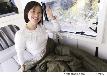 woman sleeping in a camper woman sleeping in a camper 111522997