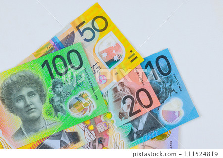 Various Australian dollars currency banknotes in different denominations on white background 111524819